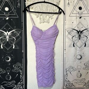 Lilac mesh ruched body on mini dress. Adjustable straps. Slim fitting.